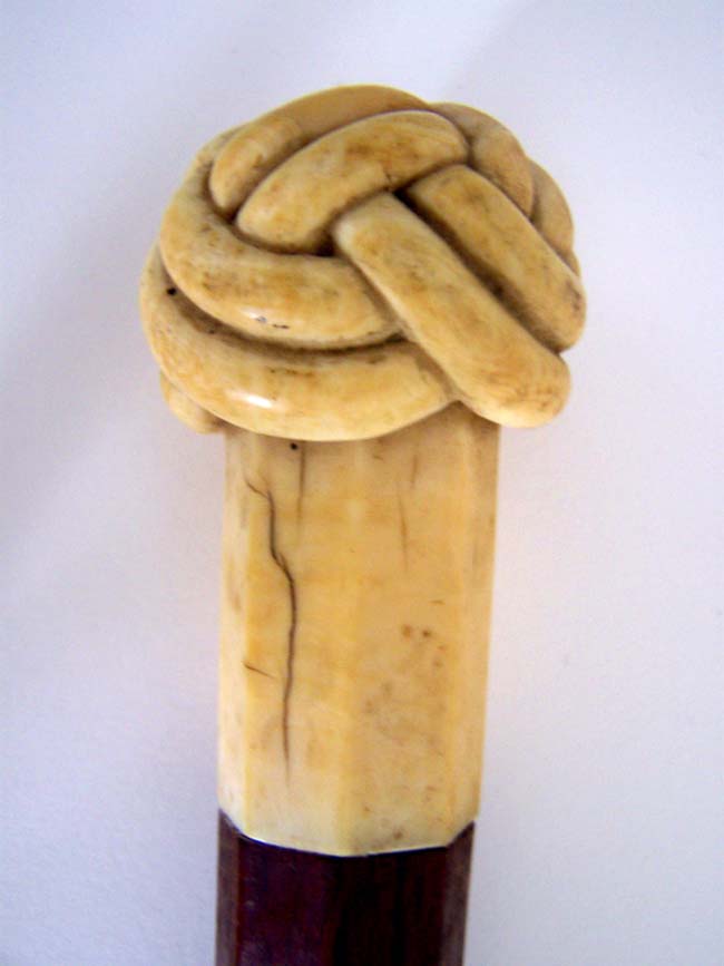 A Magnificent Antique Rosewood Cane with Carved Whale Ivory 'Turks Head' Knob